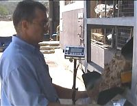 Using a machine to fill sand bags