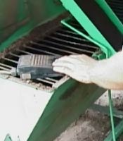 Hand_operation_of_fertiliser_activator_for_large_pots