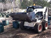 bucket-bag-filler-with-forklift-bobcat